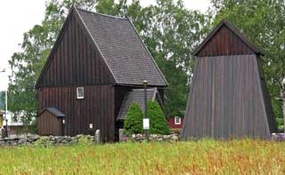 A Kyrka in Hedared - one of the oldest in Sweden. It is constructed very simply. The bell tower stands separately to the right. Buildings like that are common in the north of Sweden and in Norway.